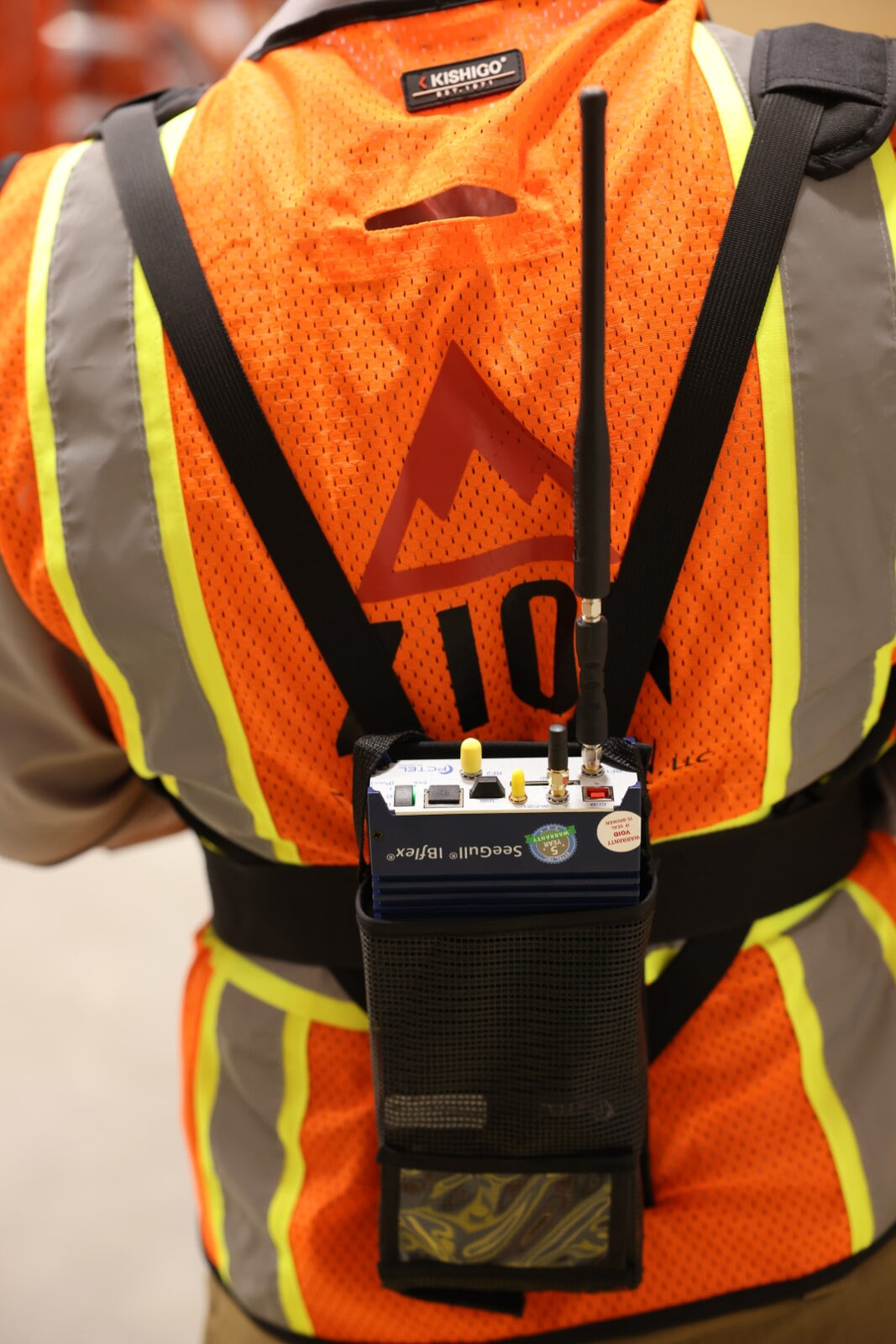 PCTEL SeeGull IBflex RF survey receiver mounted to a high-visibility safety vest with Zion logo