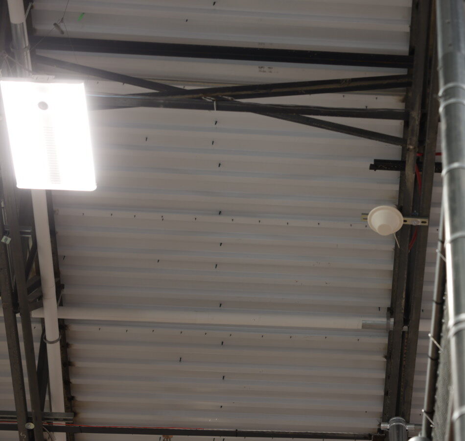 ERCES DAS donor / service antenna mounted to ceiling truss in a commercial building